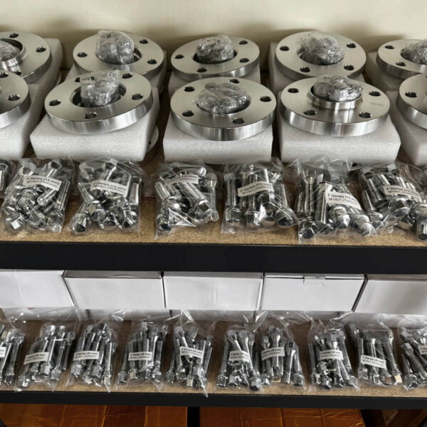 15mm thickness BMW wheel spacer kit with bolts that will fit most BMW E-Series models (Image 3)